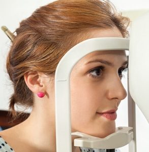 Woman being examined — Optometrist in Mareeba, QLD